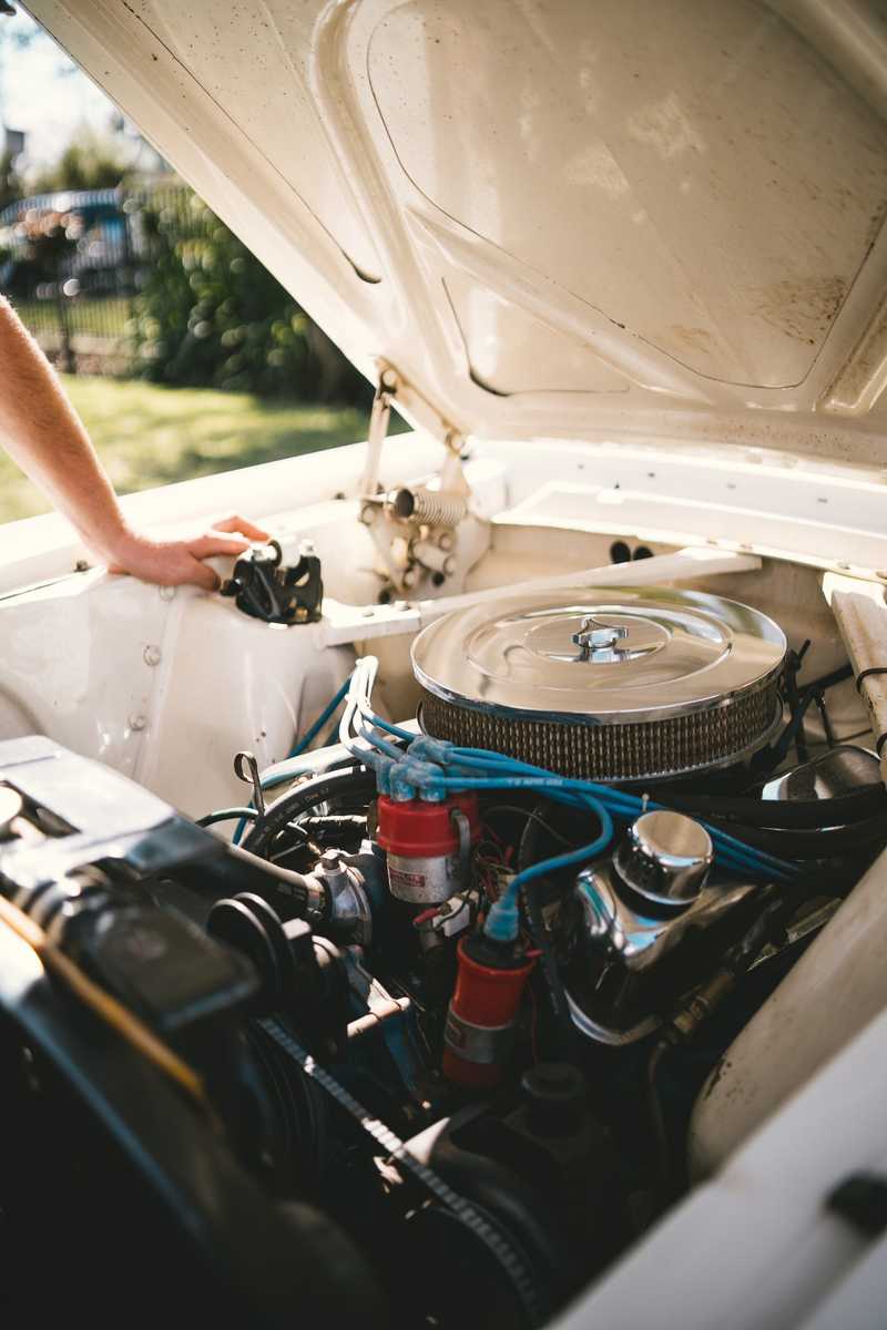 Open car hood showing simple engine