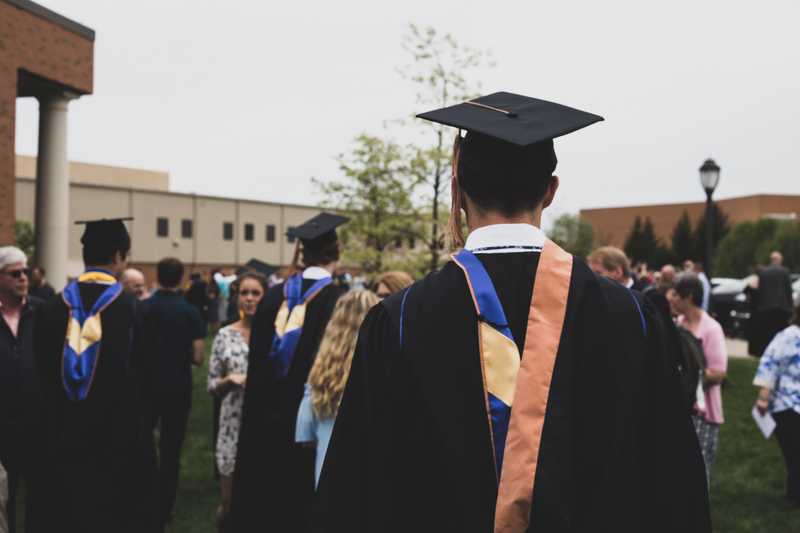 Man walking from degree ceremony