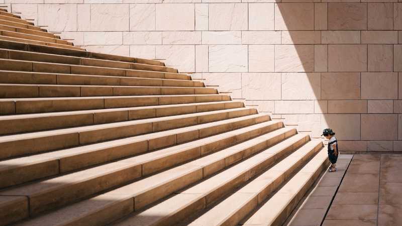 small child looking at daunting steps