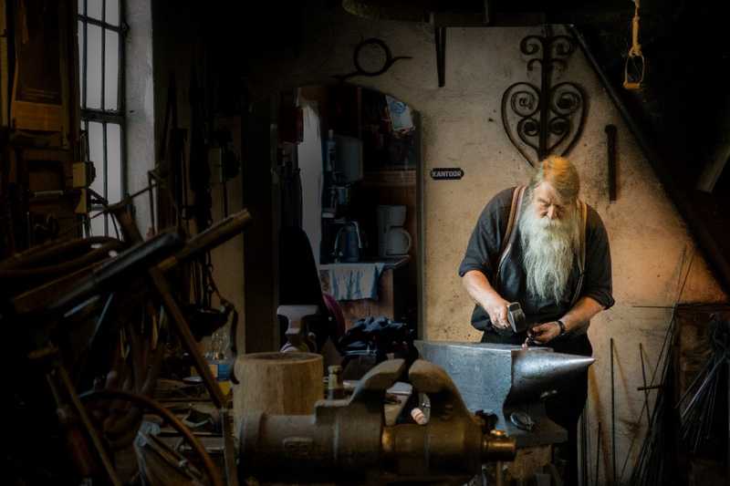 Master craftsman working on an anvil